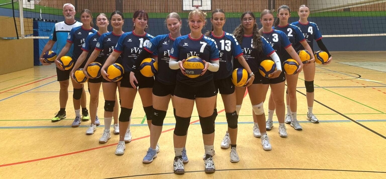 Volleyballmannschaft in Sportkleidung.